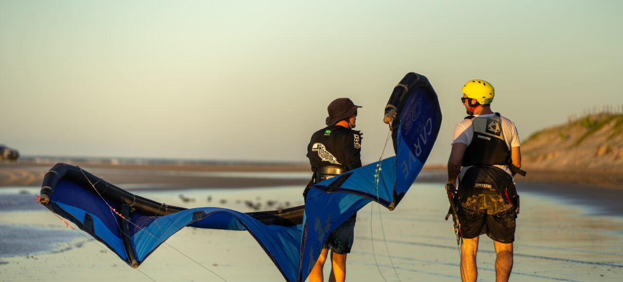 kitesurf teacher with student on the beach