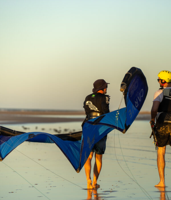 kitesurf teacher with student on the beach