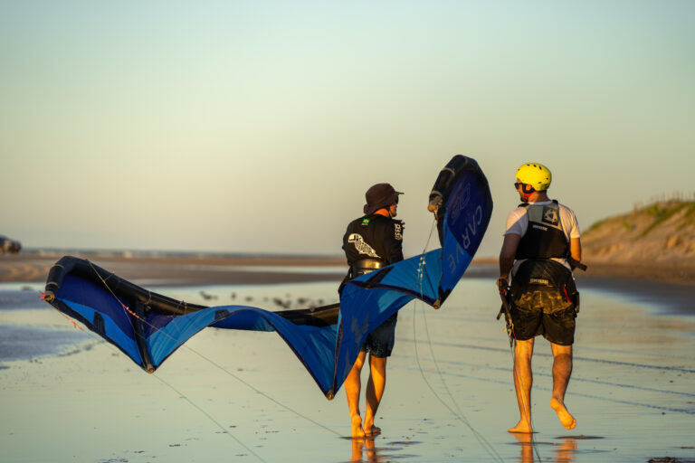 kitesurf teacher with student on the beach