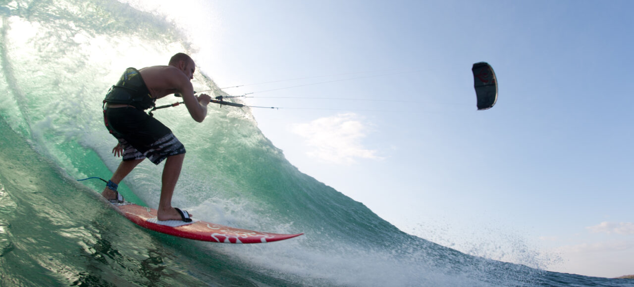kitesurfing a wave in portugal