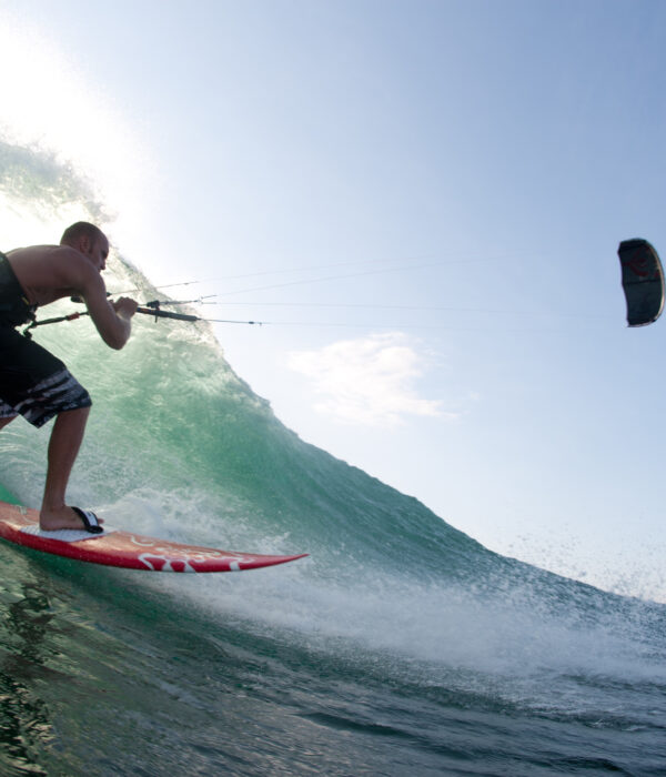 kitesurfing a wave in portugal