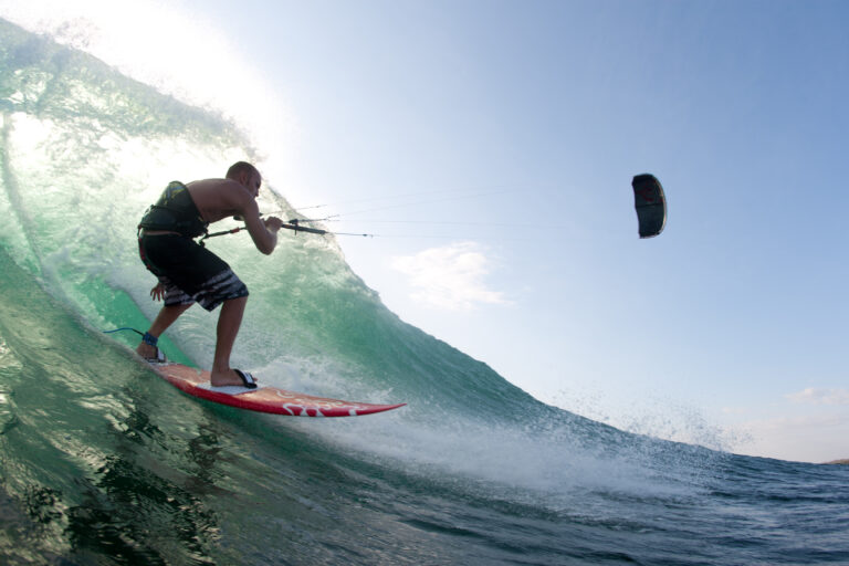 kitesurfing a wave in portugal
